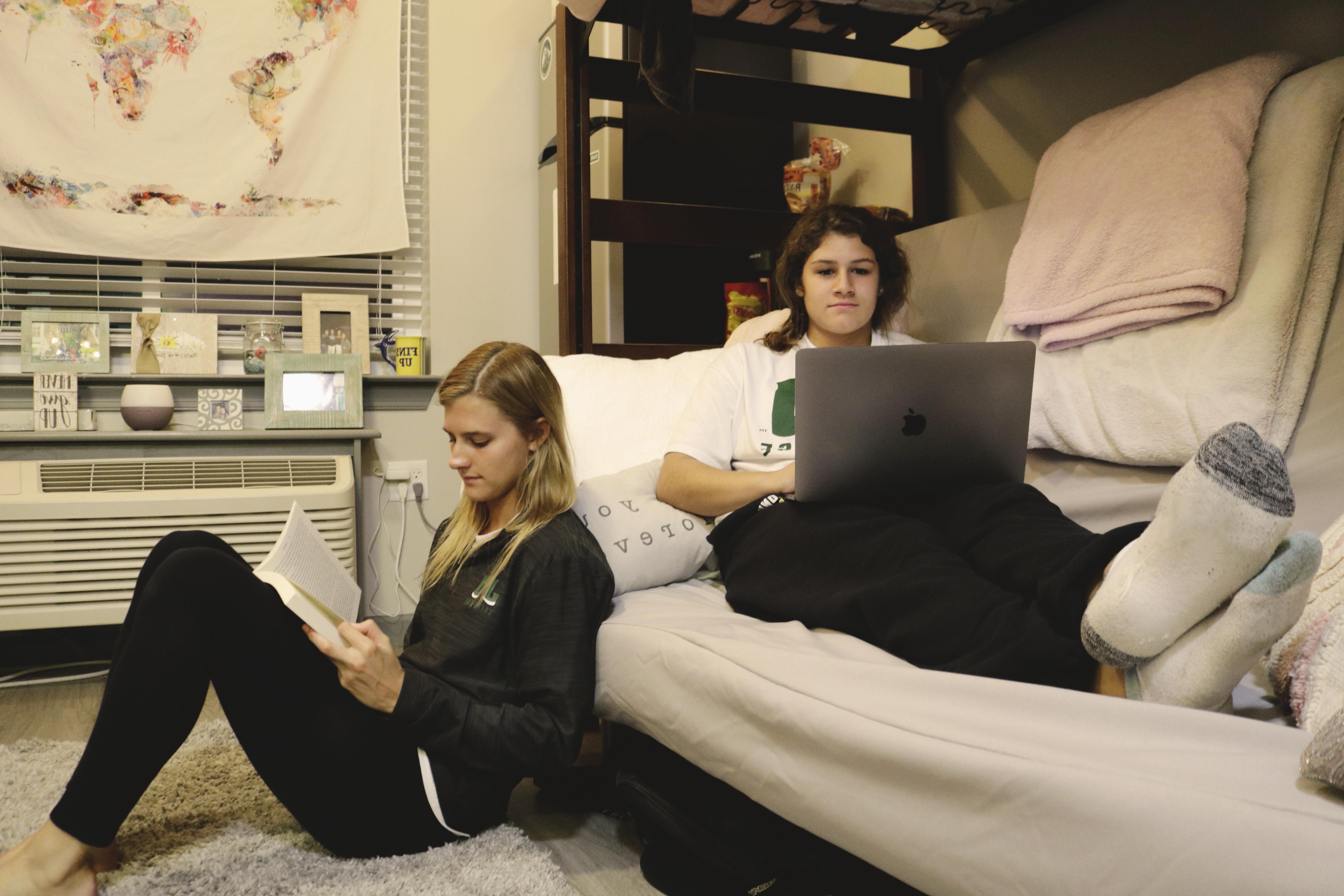学生 sitting inside dorm room