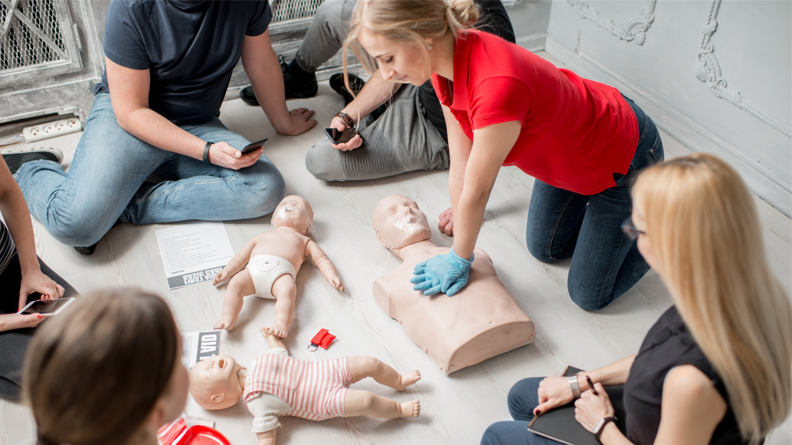 Students practice CPR on medical manikins